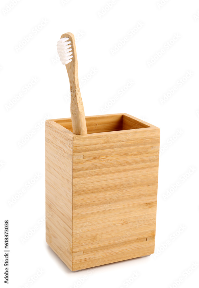 Bamboo tooth brush in holder on white background