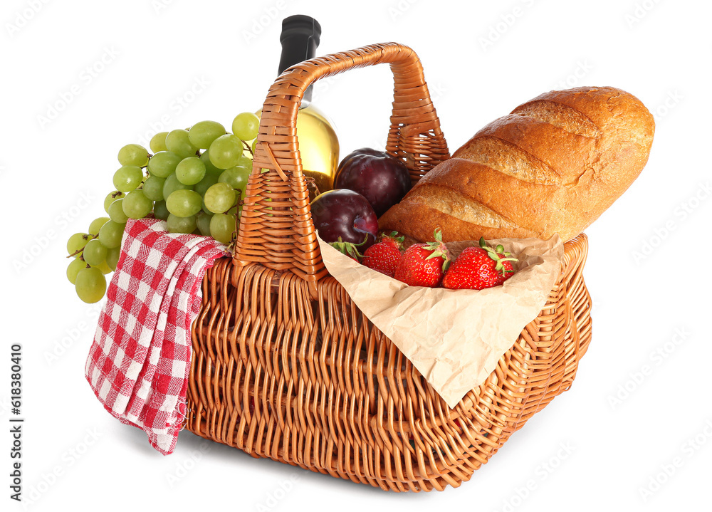 Wicker basket with tasty food for picnic and wine on white background