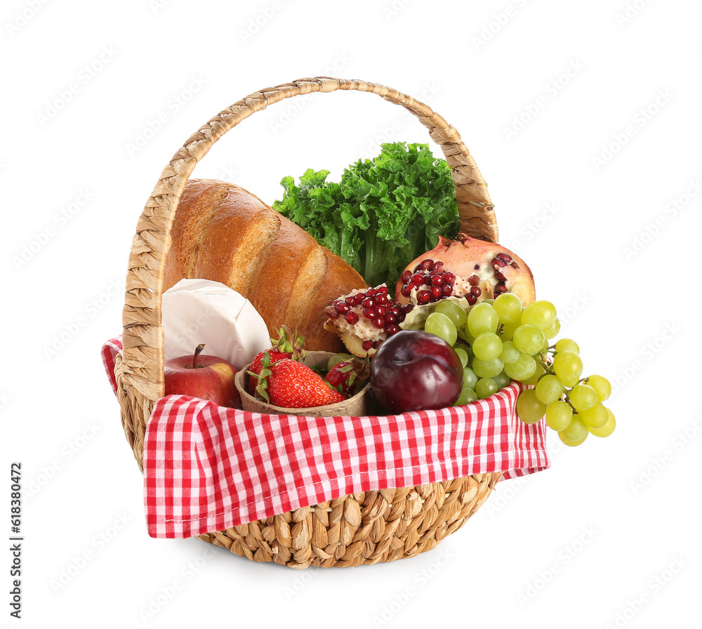 Wicker basket with delicious food for picnic on white background