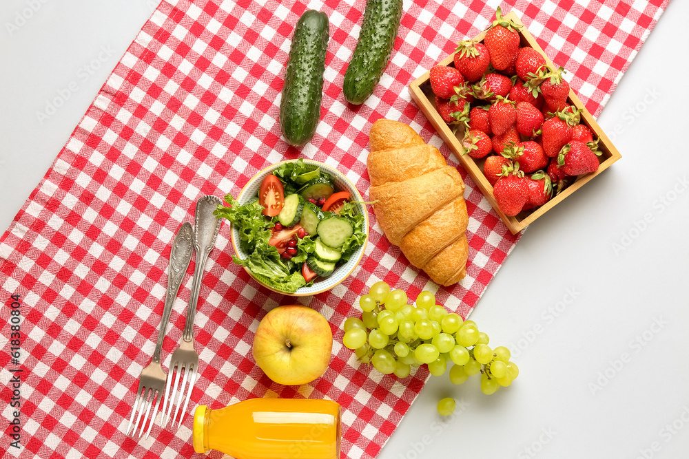 Bowl with salad, tasty food and juice for picnic on white background