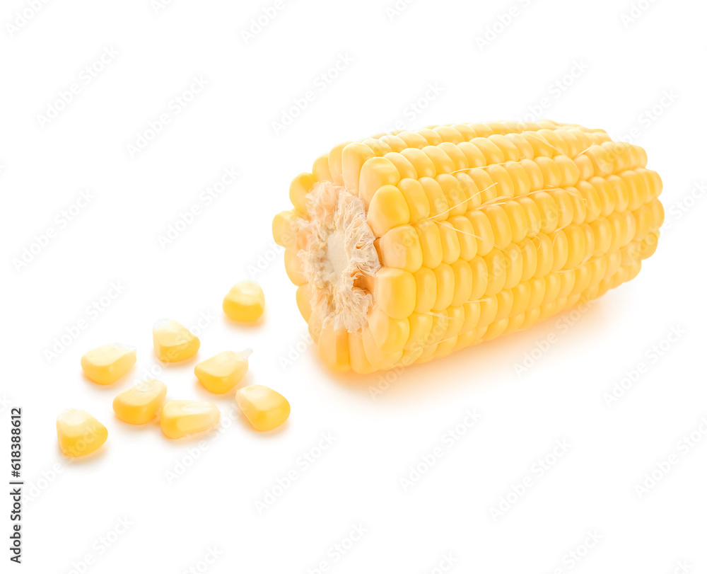 Cut fresh corn cob and seeds on white background