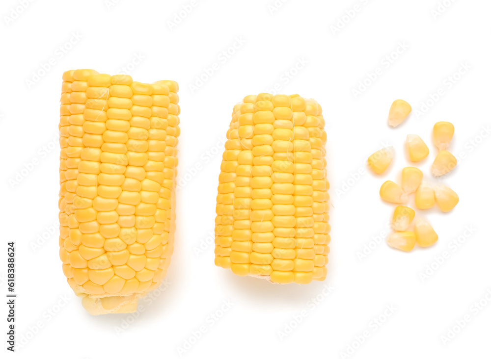 Cut fresh corn cobs and seeds on white background