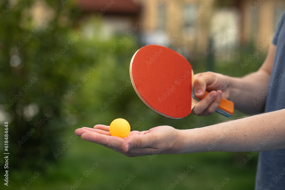 table tennis player doing a serve, close-up, The concept of sport and healthy lifestyle.