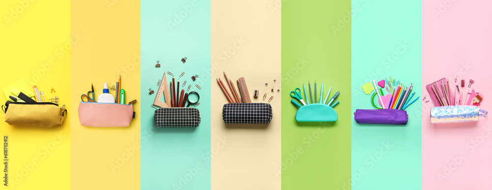 Collection of pencil cases with school stationery on color background