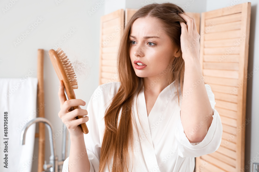 Young woman with hair loss  problem at home