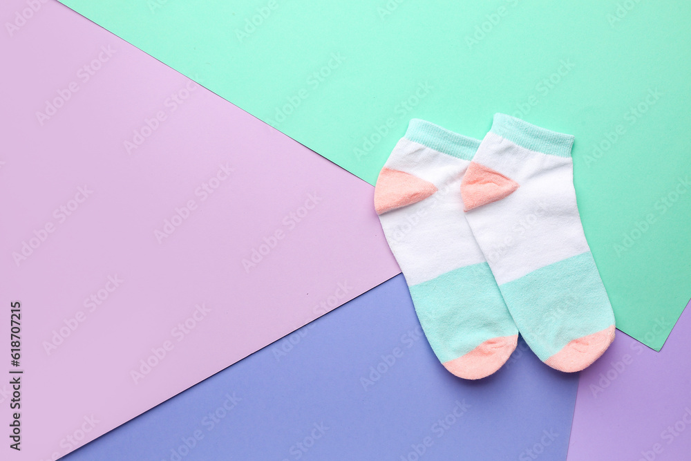 Cotton socks on color background