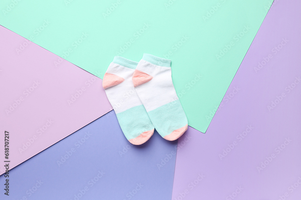 Cotton socks on color background