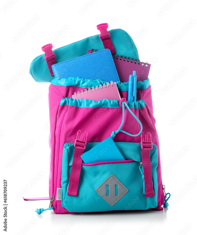 Color school backpack with notebooks and pens on white background