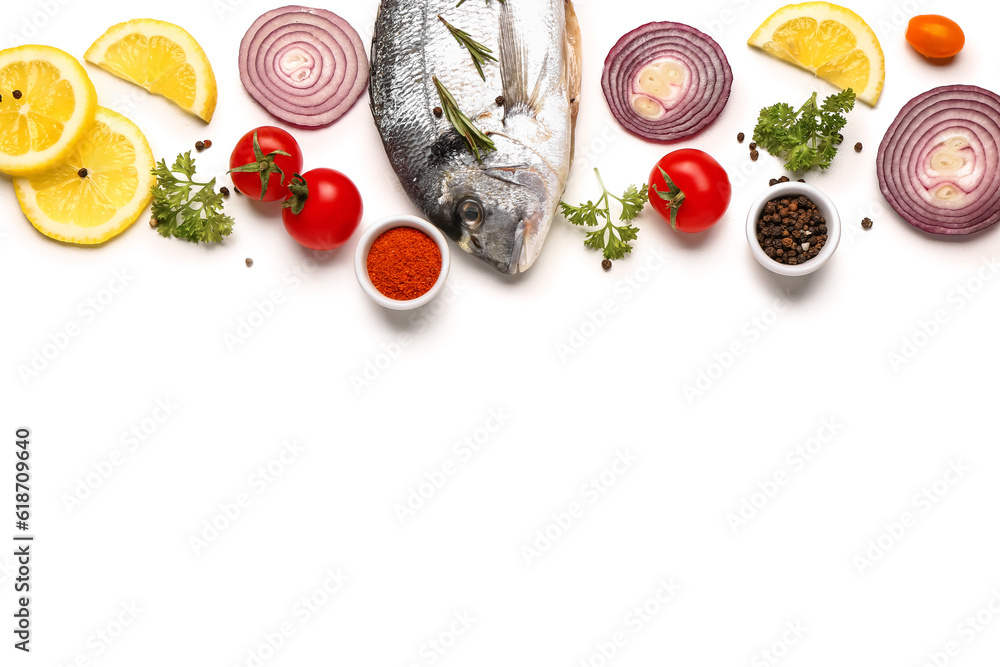 Raw dorado fish with ingredients on white background