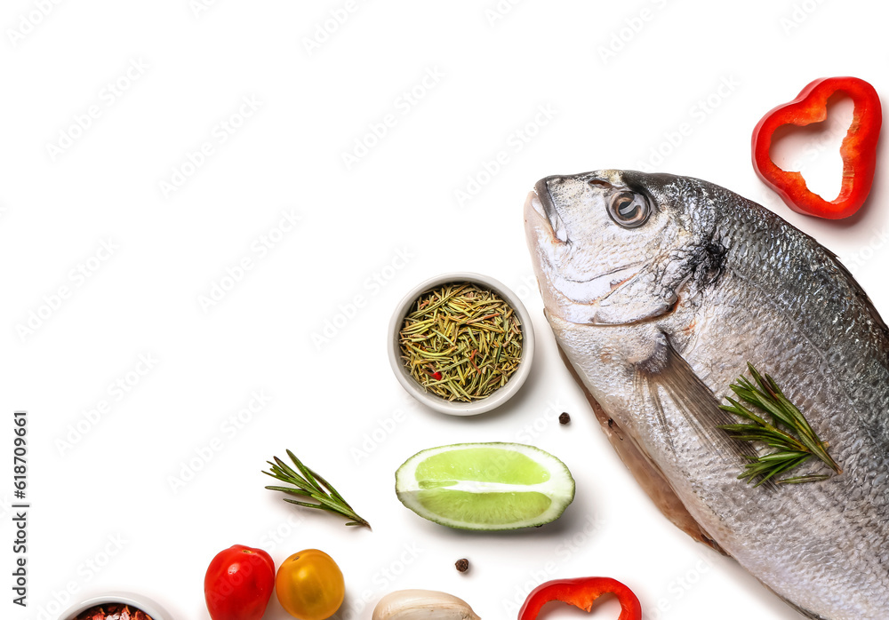 Raw dorado fish with ingredients on white background