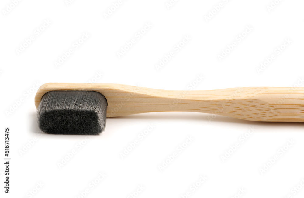 Bamboo tooth brush on white background, closeup