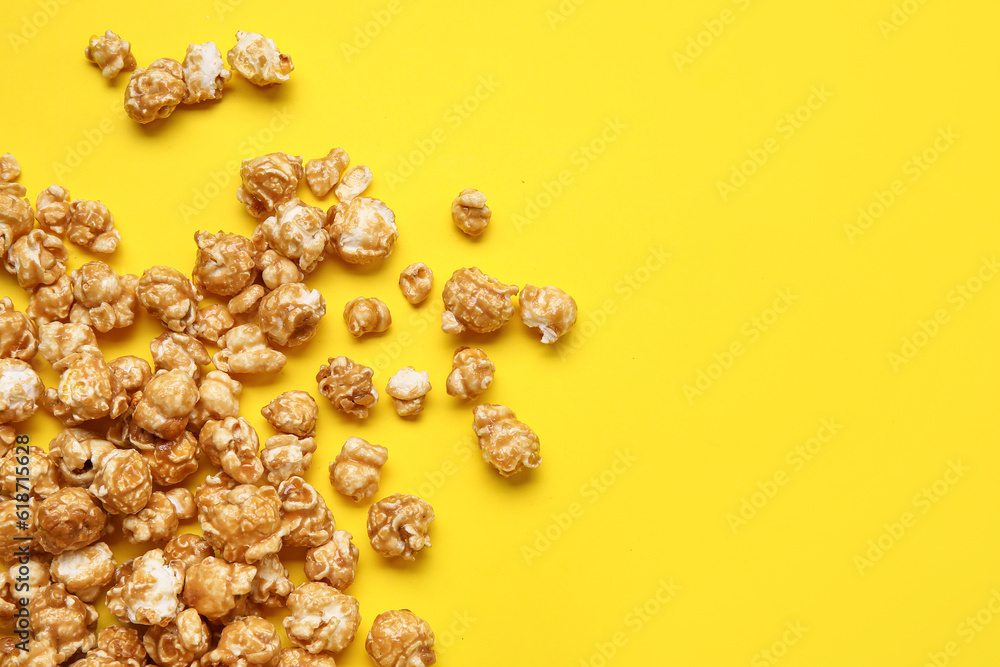 Tasty popcorn on yellow background