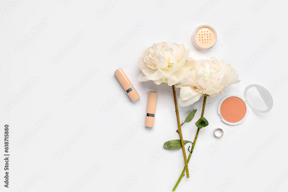 Composition with cosmetics and beautiful peony flowers on white background