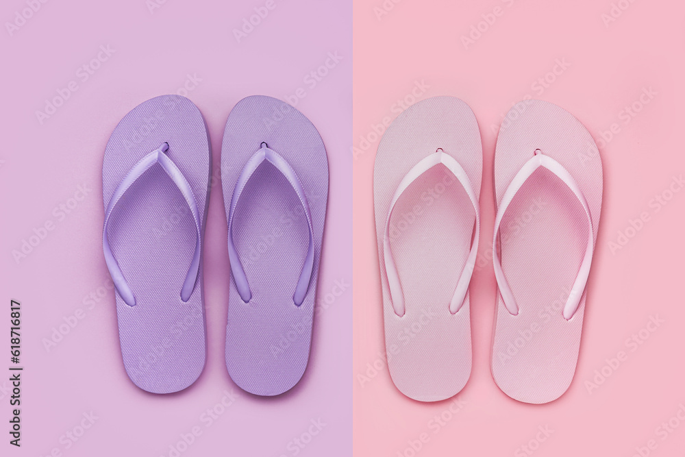 Pink and lilac flip-flops on color background