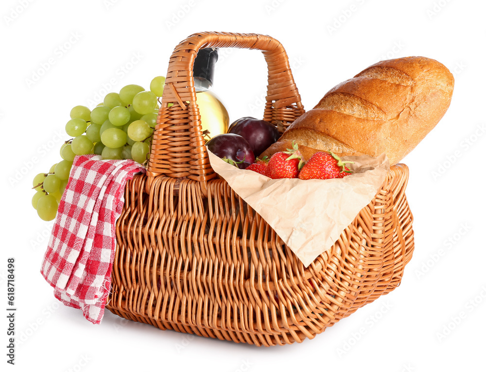 Wicker basket with tasty food for picnic and wine on white background