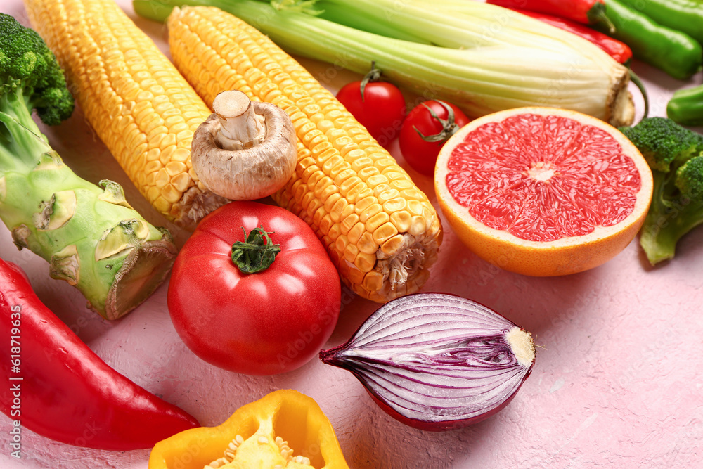 Fresh ripe vegetables on pink background, closeup