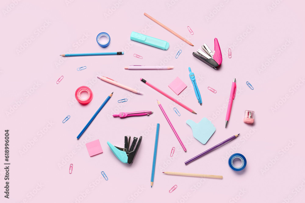 Composition with stationery supplies on pink background