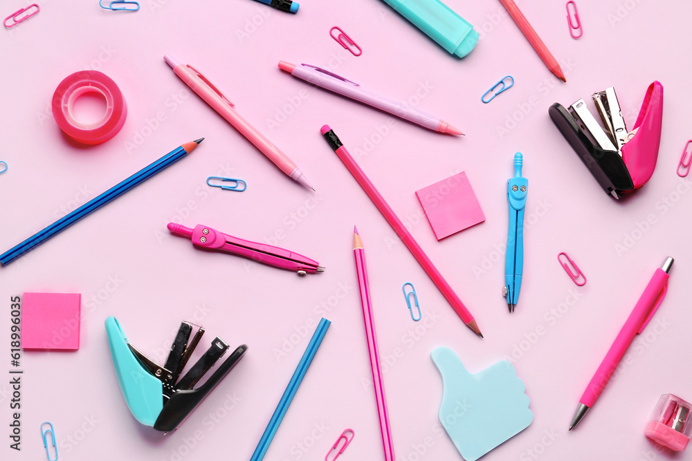 Composition with stationery supplies on pink background