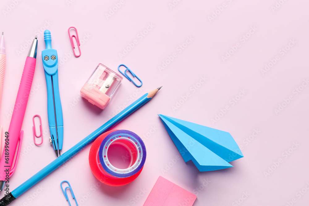 Composition with stationery supplies on pink background