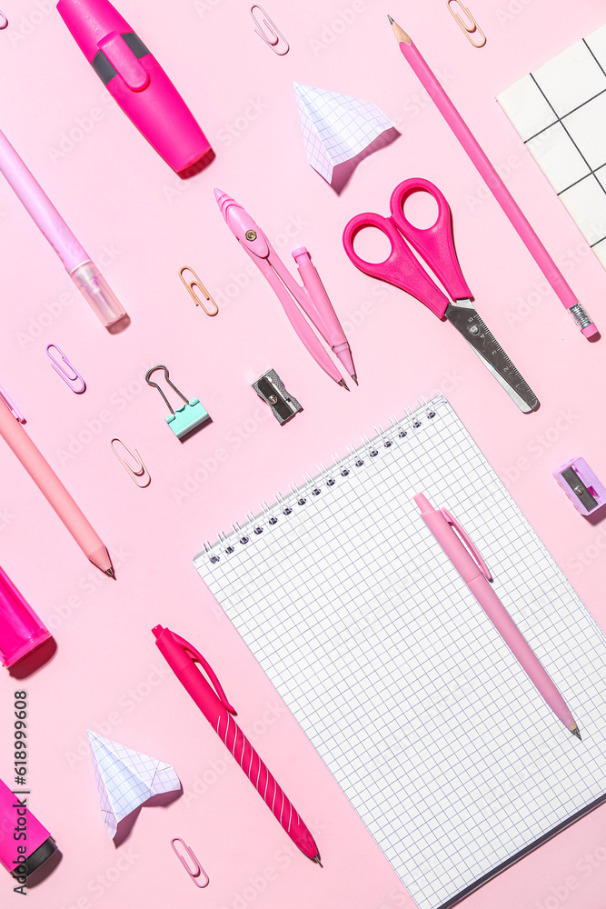 Set of different school stationery on pink background