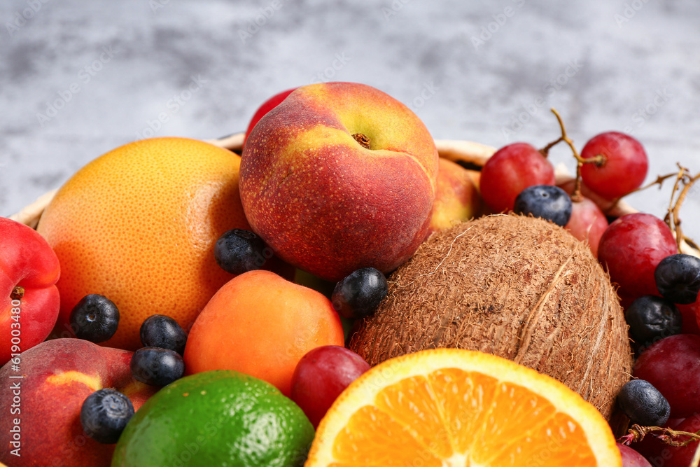 Bowl with different fresh fruits, closeup