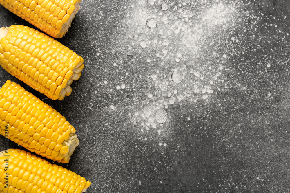 Cut fresh corn cobs on grey background