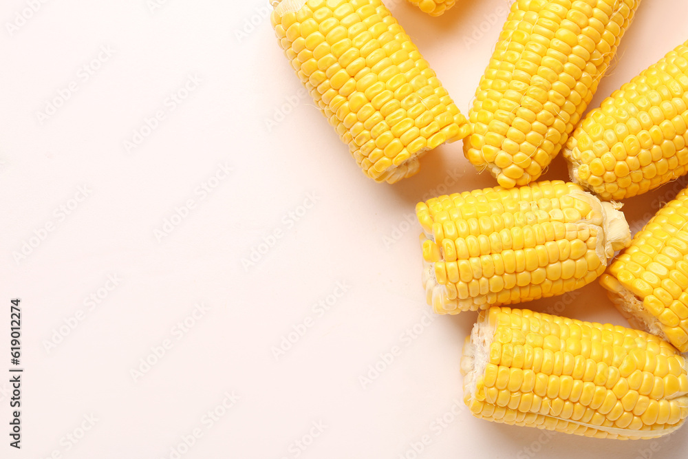 Cut fresh corn cobs on white background