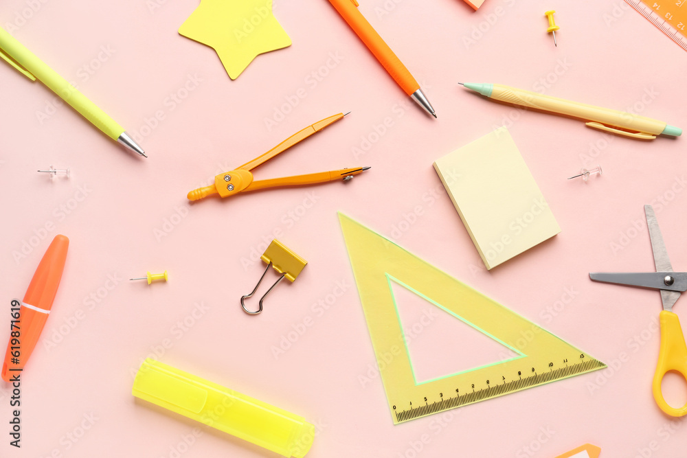 Composition with stationery supplies on pink background