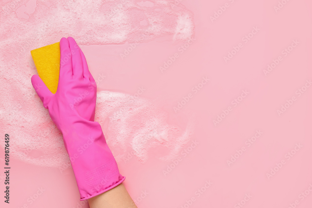 Woman with sponge and foam cleaning on pink background