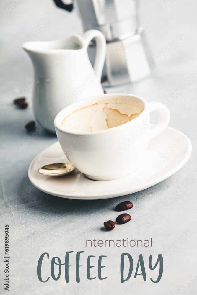 Empty coffee cup after drink on concrete background, coffee day