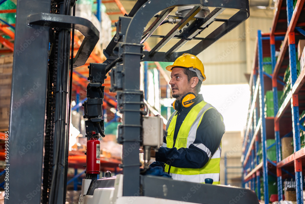 Caucasian attractive man industrial worker work in manufacturing plant. 