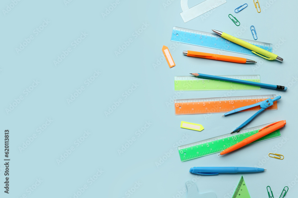 Composition with stationery supplies on blue background