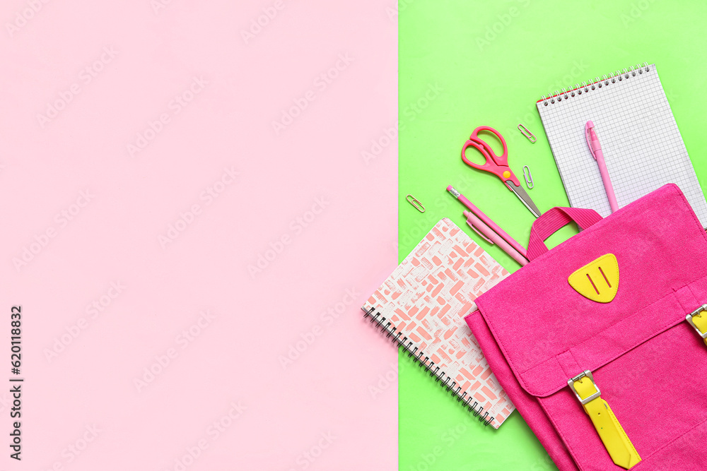 School backpack, notebooks and stationery on color background