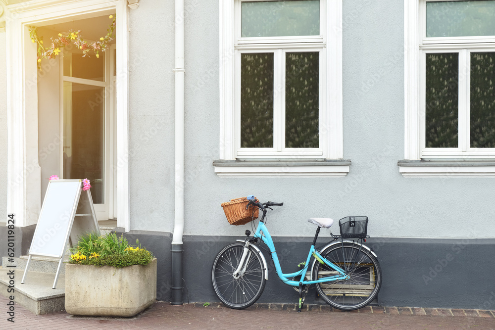 New stylish bicycle near building on city street