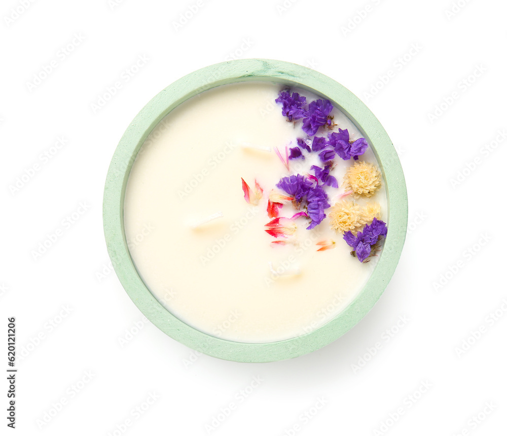 Holder with candle and flowers on white background