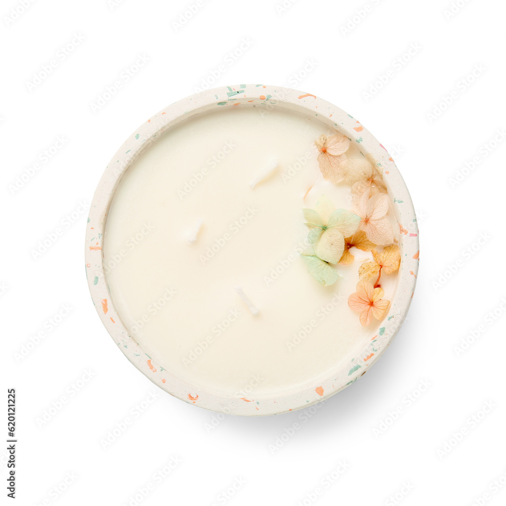 Holder with candle and flowers on white background