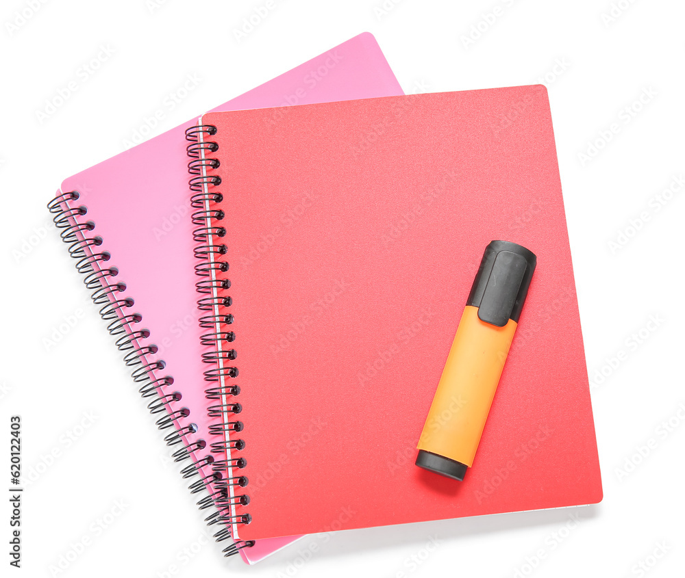 Different colorful notebooks with marker isolated on white background