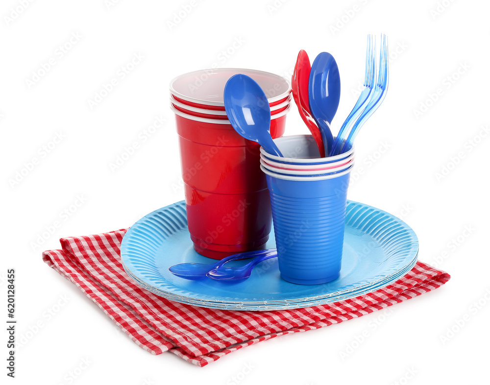 Plastic and paper tableware for picnic on white background