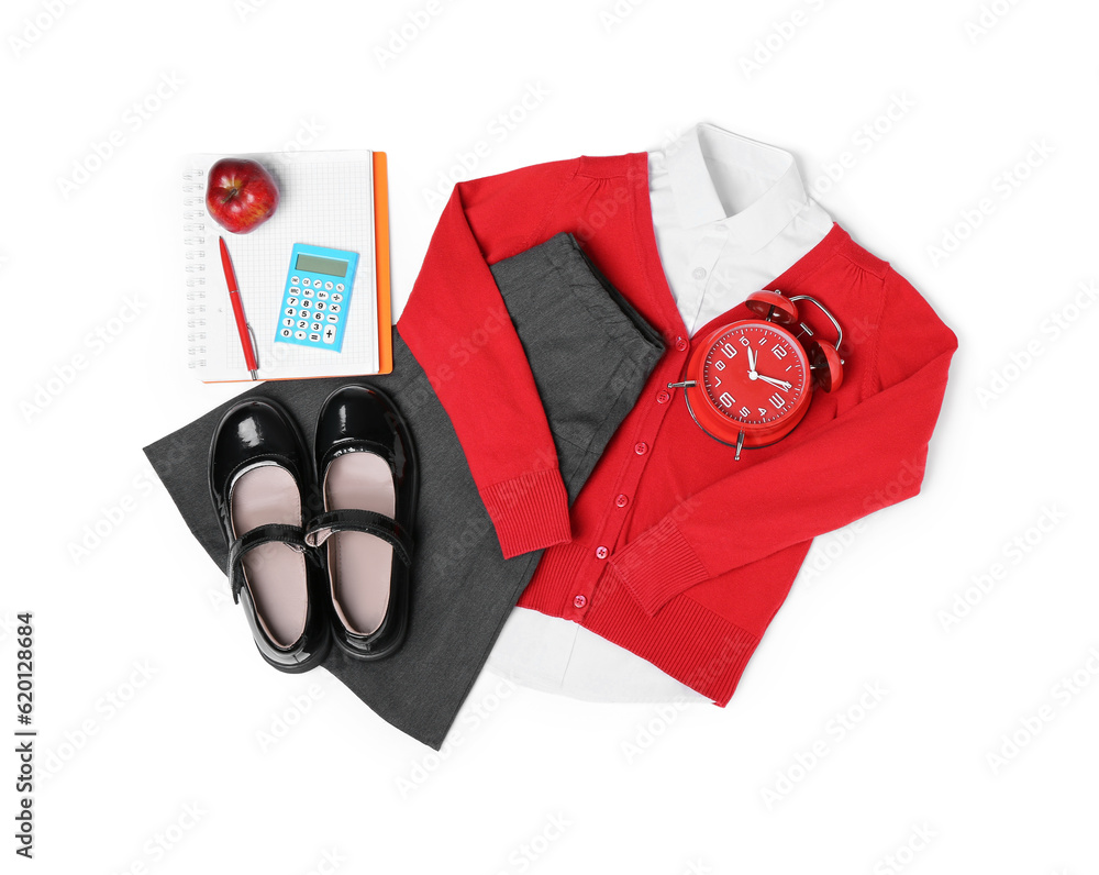 Stylish school uniform with fresh apple, alarm clock and stationery isolated on white background