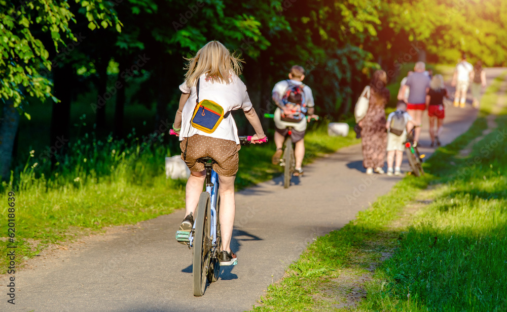 Cyclist ride on the bike path in the city Park 