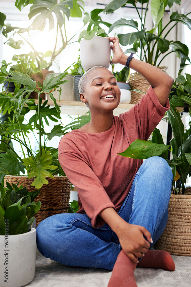 Portrait of a black woman, garden and happy with plant on head and care for plants, leaves and sunsh