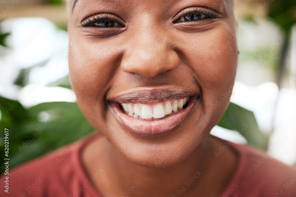 Portrait, plants and teeth with a black woman gardener in her home for sustainability or green growt