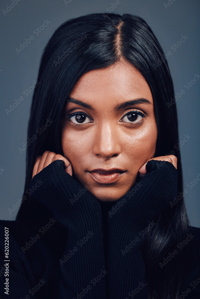 Face, beauty touch and confidence of woman in studio isolated on a gray background. Serious portrait