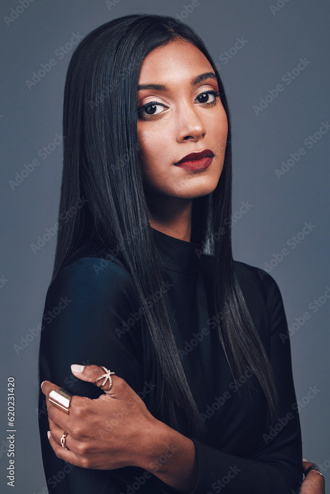 Portrait, beauty and serious woman with makeup in studio isolated on a gray background. Face, skinca