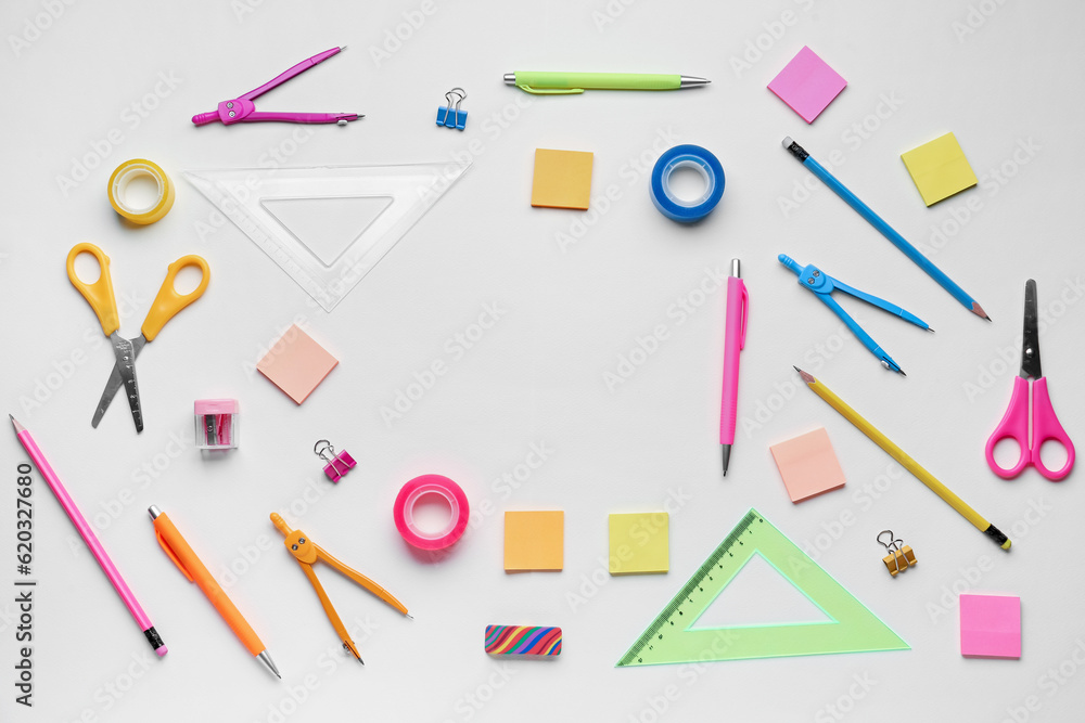 Frame made of different stationery on light background