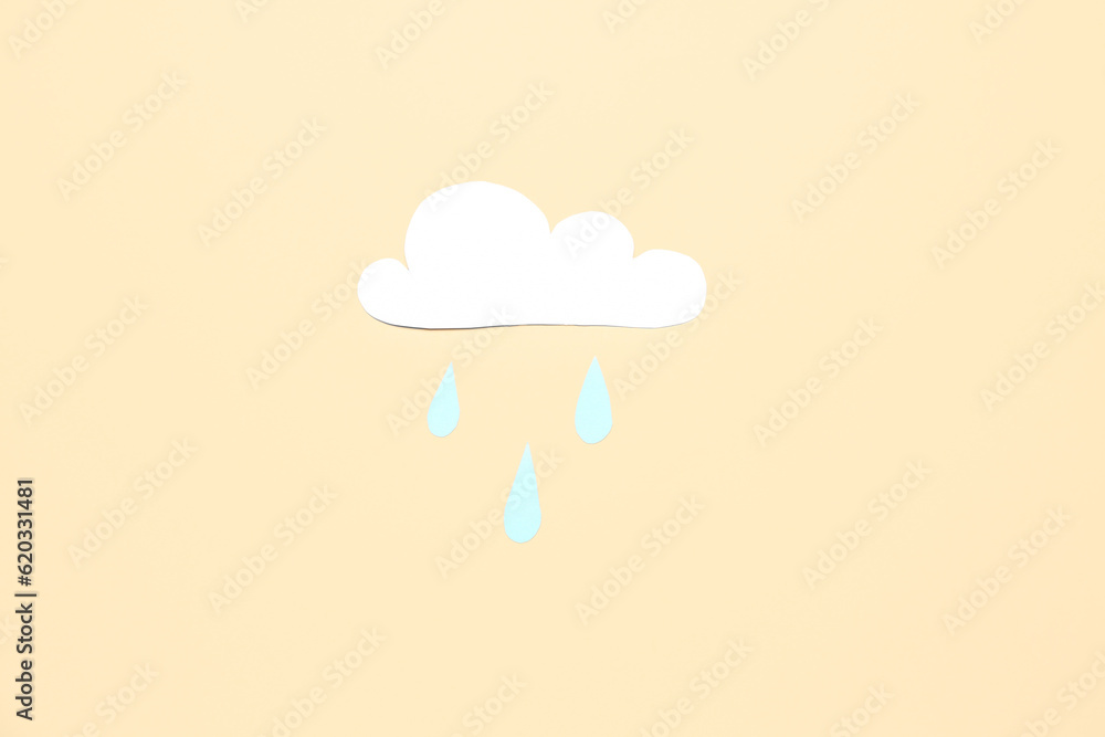 Paper cloud with rain drops on beige background. Weather forecast concept