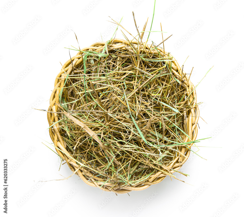 Straw in basket on white background