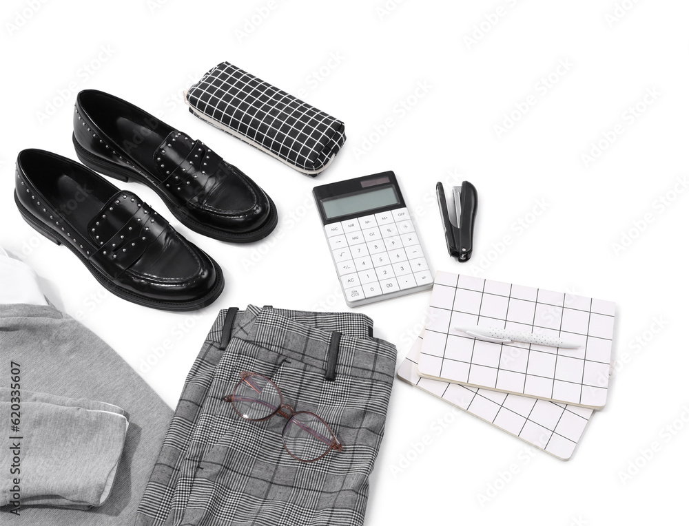 Composition with stylish school uniform, shoes and stationery on white background