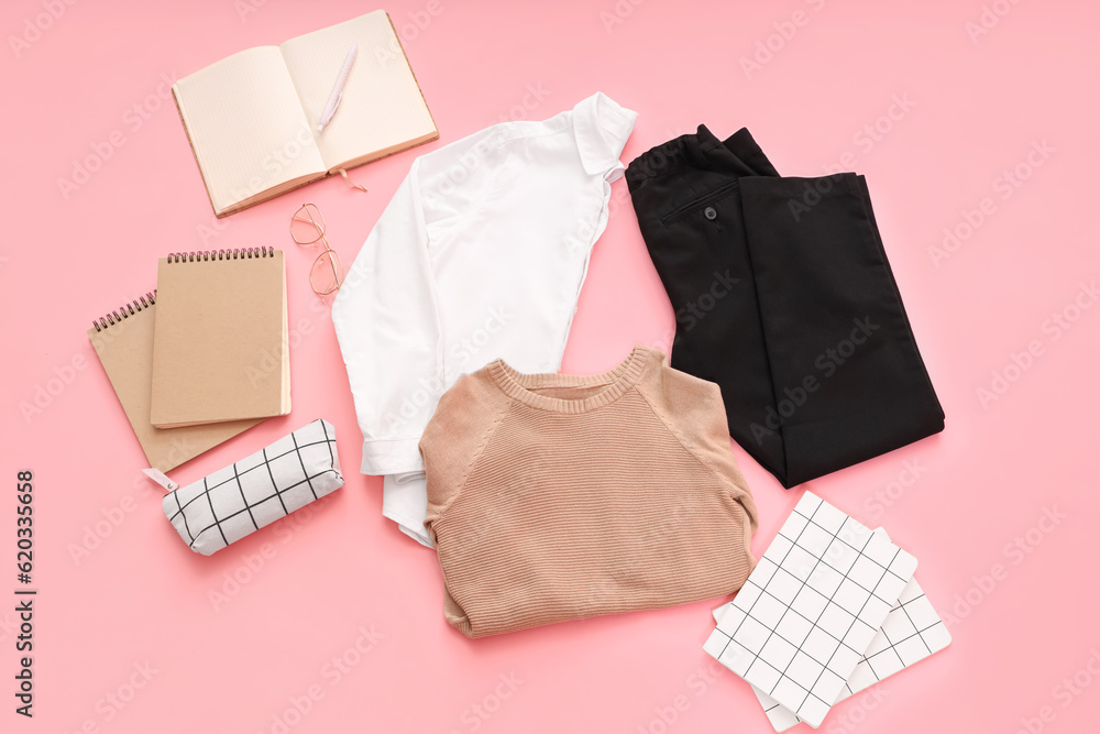 Composition with stylish school uniform, eyeglasses and notebooks on pink background