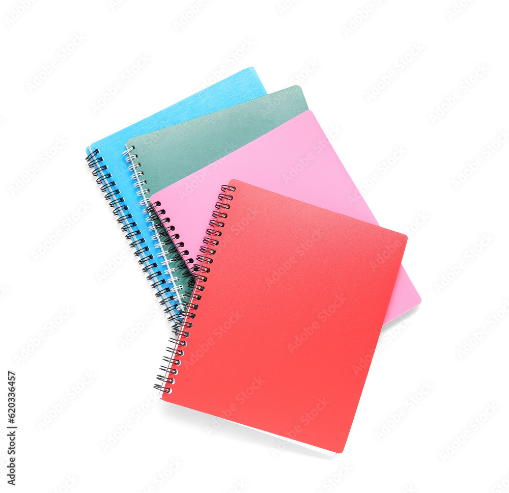 Different colorful notebooks isolated on white background